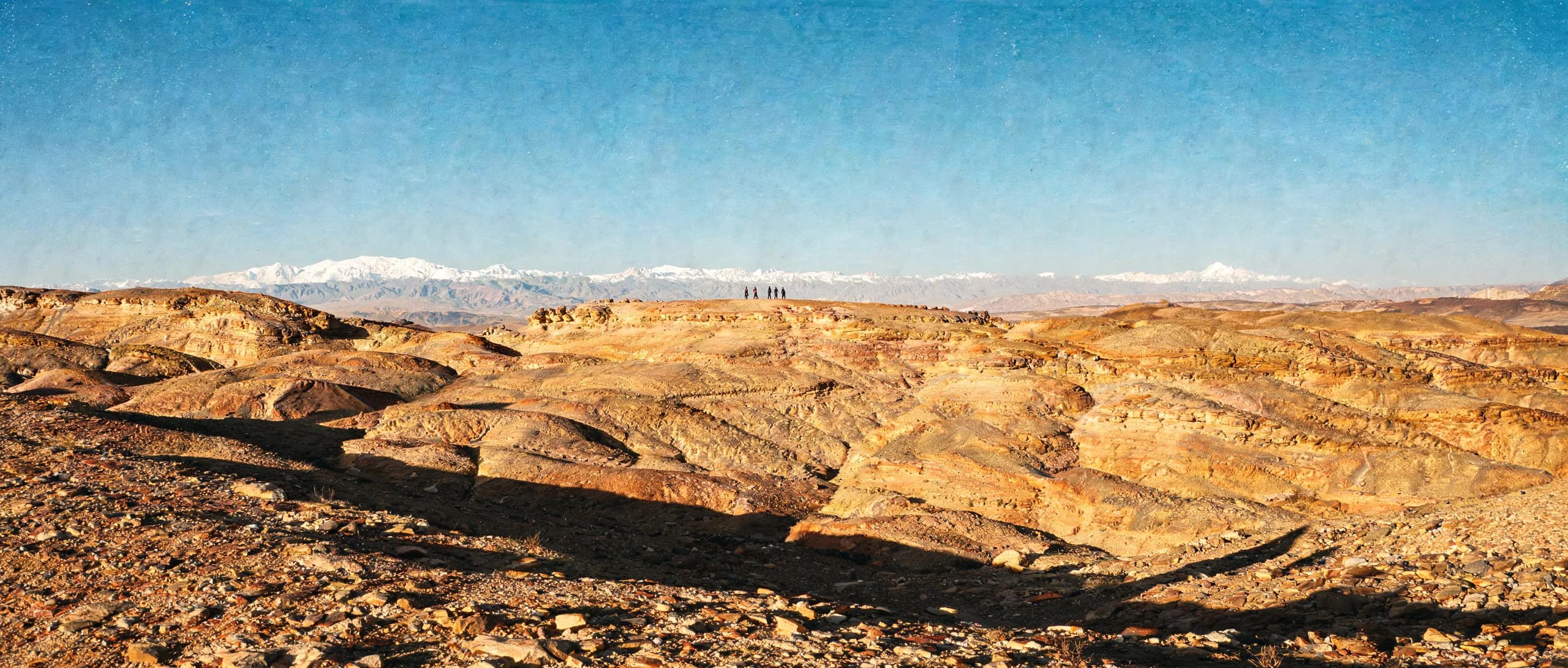 Agafay stone desert plateau with the Atlas mountains on the horizon
